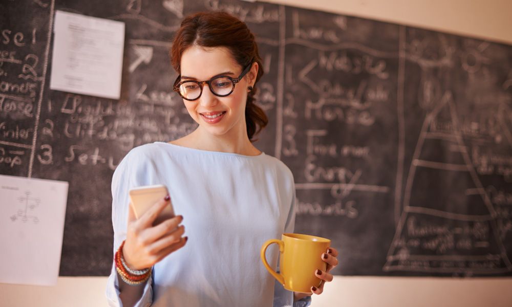 woman receiving notification and smiling