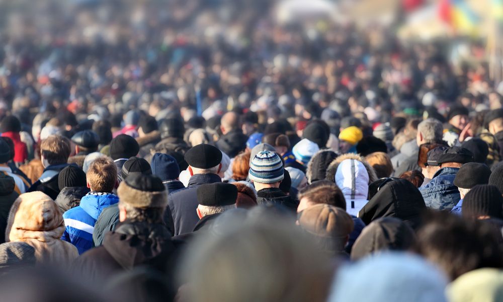 Crowd Of Anonymous People On Street In City Center